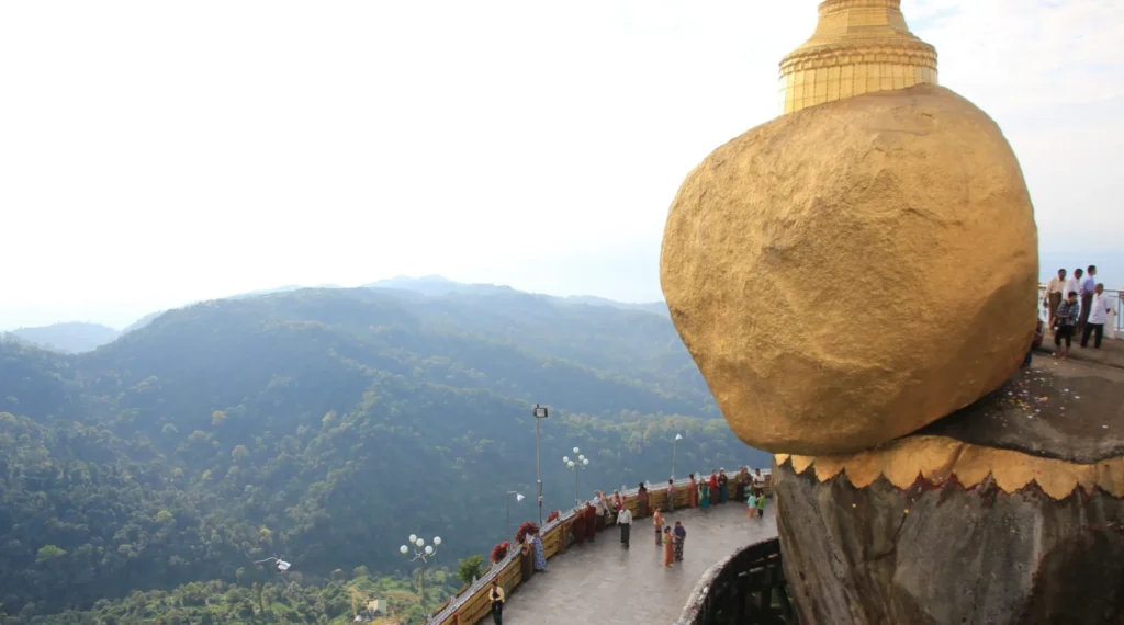 Golden Rock in Myanmar balancing on cliff – mysterious floating boulder with golden pagoda